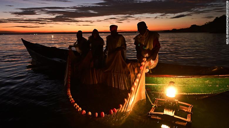 Kenyan fisherman pull up their nets in the early morning as they fish on Lake Victoria.